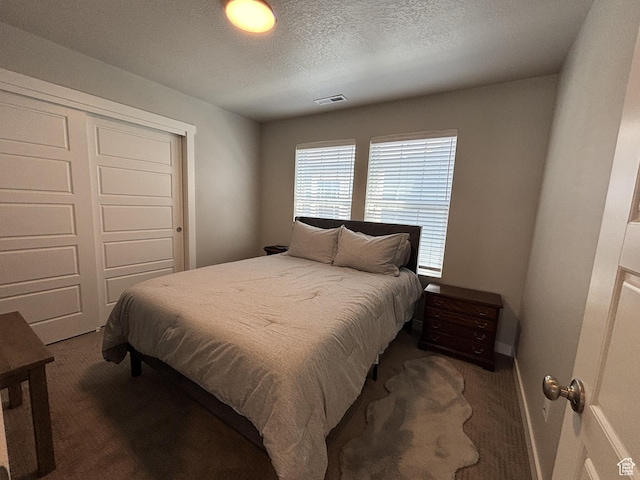 11603 S Outfitter Way S, Jordan, UT 84009 - bedroom with carpet floors, a closet, a textured ceiling, and baseboards