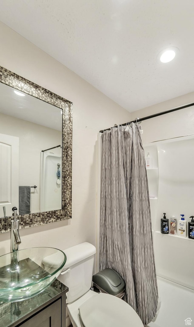 583 N 640 W, Tooele, UT 84074 - full bath featuring toilet, vanity, a shower with shower curtain, and recessed lighting