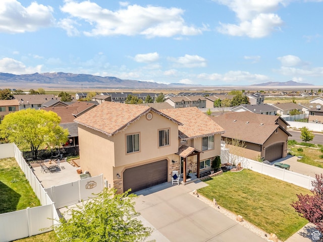 583 N 640 W, Tooele, UT 84074 - view of front of house featuring stucco siding, a residential view, and a mountain view