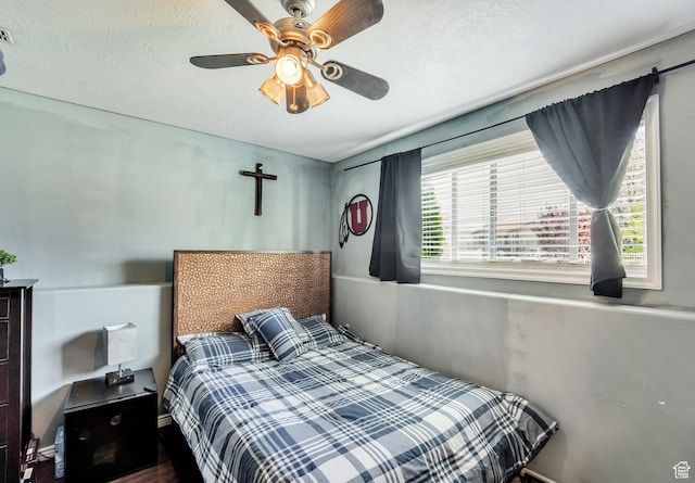 583 N 640 W, Tooele, UT 84074 - bedroom with a ceiling fan and wood finished floors