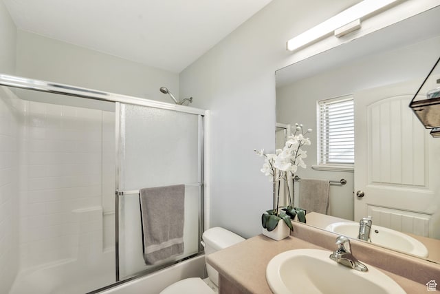 583 N 640 W, Tooele, UT 84074 - full bathroom featuring vanity, toilet, and bath / shower combo with glass door