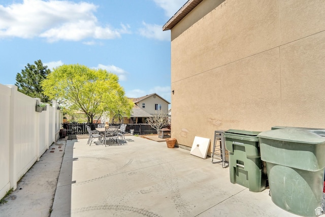 583 N 640 W, Tooele, UT 84074 - fenced backyard featuring outdoor dining space and a patio