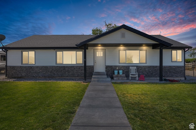 745 W Mckellar, Tooele, UT 84074 - view of front of property with stone siding, a yard, and a shingled roof