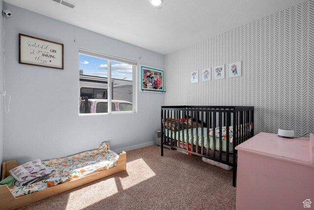 745 W Mckellar, Tooele, UT 84074 - bedroom with carpet, a crib, wallpapered walls, and baseboards
