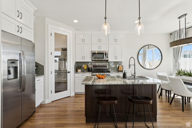 3779 S 3250 W, West Haven, UT 84401 - kitchen with stainless steel appliances, a sink, backsplash, dark wood-style floors, and recessed lighting
