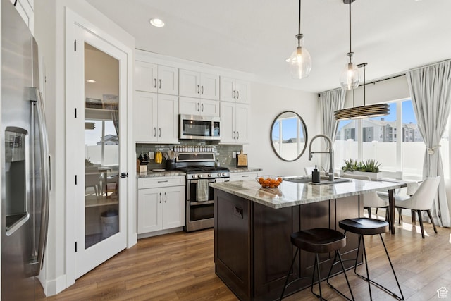 3779 S 3250 W, West Haven, UT 84401 - kitchen with stainless steel appliances, a sink, healthy amount of natural light, backsplash, and recessed lighting