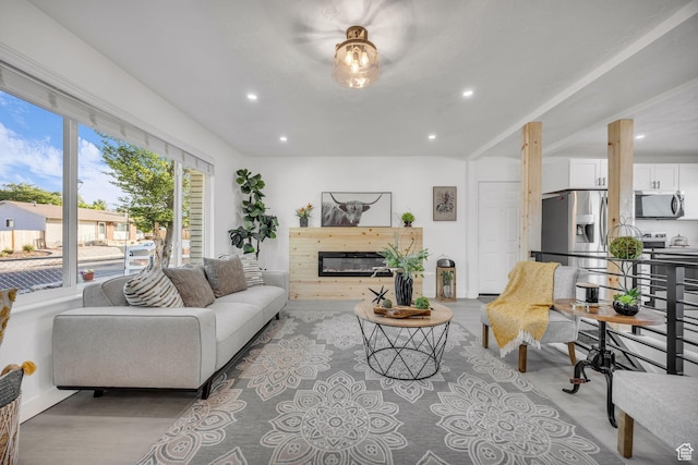 5494 W Townsend Way, West Valley City, UT 84118 - living room featuring recessed lighting, a glass covered fireplace, wood finished floors, and baseboards