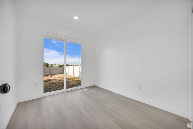 5494 W Townsend Way, West Valley City, UT 84118 - unfurnished room with baseboards, wood finished floors, and recessed lighting