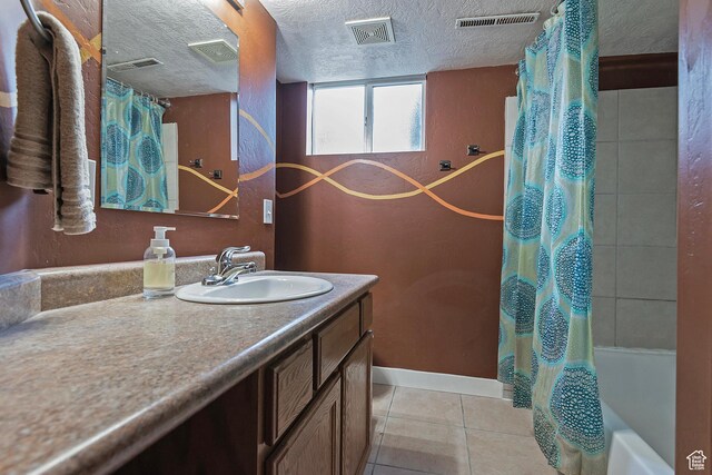628 E Wyandotte Ave S, Sandy, UT 84070 - bathroom with vanity, tile patterned floors, shower / bath combination with curtain, and a textured ceiling