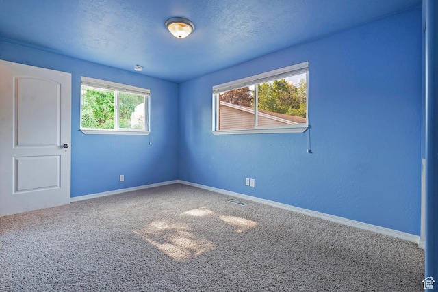 628 E Wyandotte Ave S, Sandy, UT 84070 - carpeted spare room featuring baseboards
