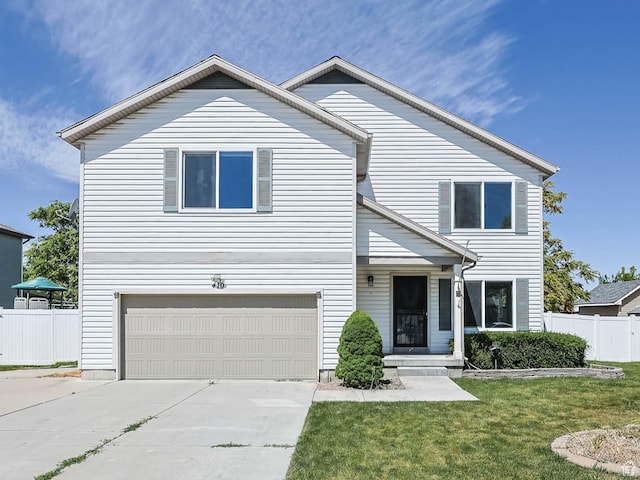 410 Wheatridge Rd, Stansbury Park, UT 84074 - view of front of property featuring an attached garage and concrete driveway