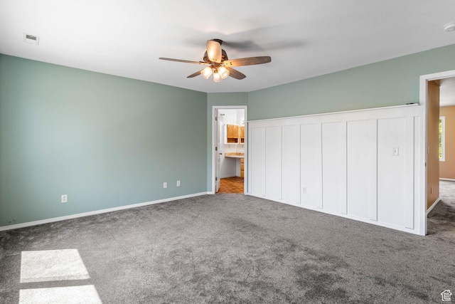 410 Wheatridge Rd, Stansbury Park, UT 84074 - unfurnished bedroom featuring carpet, baseboards, a ceiling fan, and connected bathroom