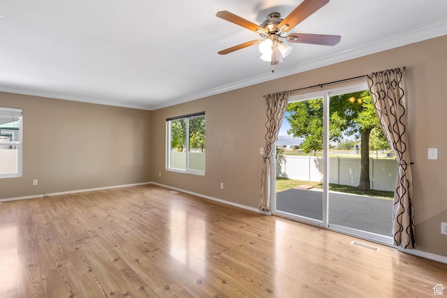 410 Wheatridge Rd, Stansbury Park, UT 84074 - empty room with ornamental molding, light wood-style flooring, a ceiling fan, and baseboards