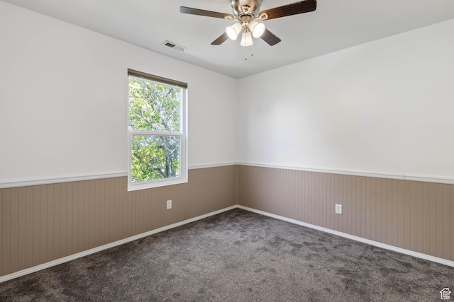 410 Wheatridge Rd, Stansbury Park, UT 84074 - carpeted empty room featuring wainscoting and a ceiling fan