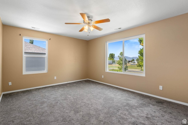 410 Wheatridge Rd, Stansbury Park, UT 84074 - spare room featuring carpet floors, ceiling fan, and baseboards