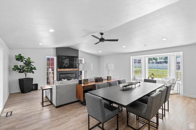 1392 N 450 E, Bountiful, UT 84010 - dining space featuring light wood-type flooring, ceiling fan, lofted ceiling, baseboards, and a textured ceiling