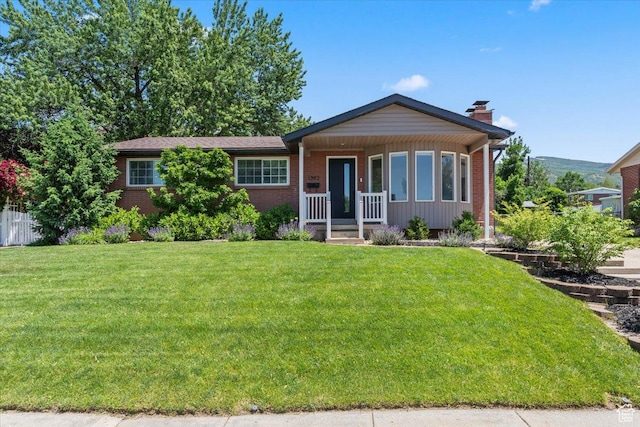 1392 N 450 E, Bountiful, UT 84010 - ranch-style house with covered porch, brick siding, and a chimney