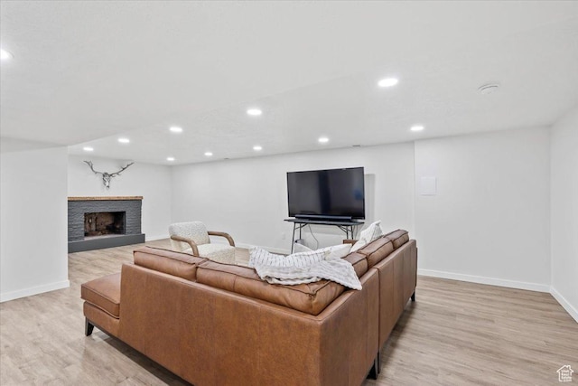 1392 N 450 E, Bountiful, UT 84010 - living room featuring baseboards, light wood-style floors, recessed lighting, and a fireplace with raised hearth