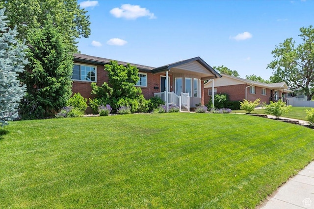 1392 N 450 E, Bountiful, UT 84010 - ranch-style home with brick siding and a front lawn