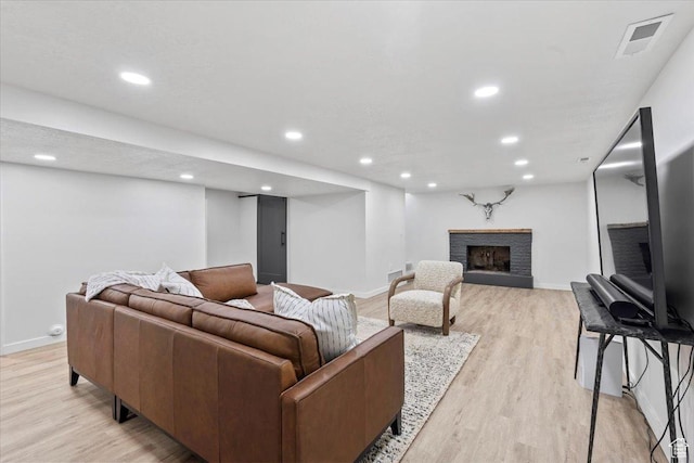 1392 N 450 E, Bountiful, UT 84010 - living room with light wood finished floors, recessed lighting, baseboards, and a fireplace