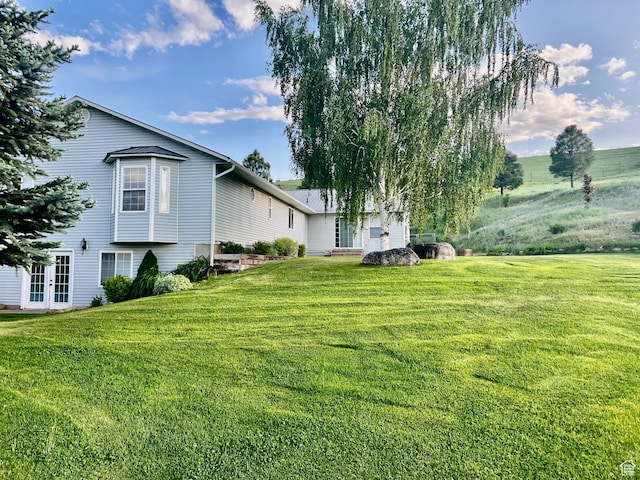 9029 N Treasureton Rd, Preston, ID 83263 - view of green lawn with french doors