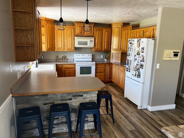9029 N Treasureton Rd, Preston, ID 83263 - kitchen with white appliances, a sink, open shelves, a peninsula, and dark wood-style floors