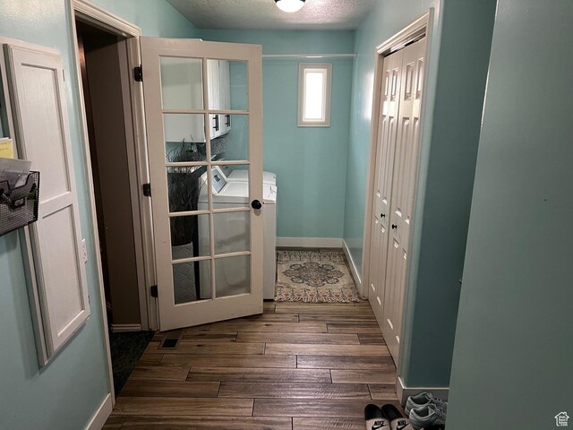 9029 N Treasureton Rd, Preston, ID 83263 - doorway with dark wood-style floors, independent washer and dryer, and a textured ceiling