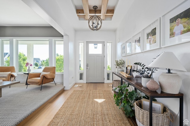 12184 N Bridgegate Way, Highland, UT 84003 - foyer entrance featuring coffered ceiling, light wood-type flooring, a chandelier, and beamed ceiling