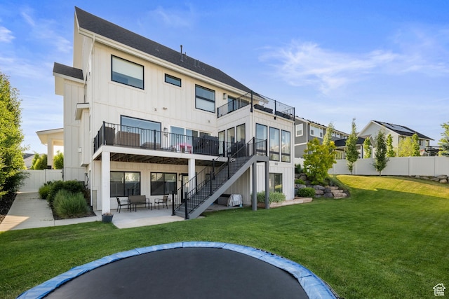 12184 N Bridgegate Way, Highland, UT 84003 - back of house featuring board and batten siding, stairs, a patio area, a balcony, and a wooden deck