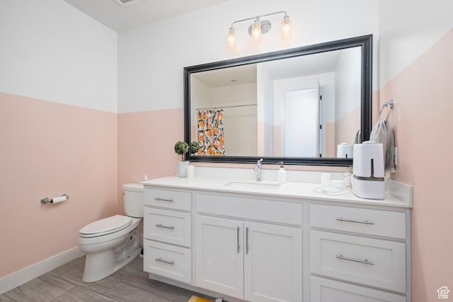 12184 N Bridgegate Way, Highland, UT 84003 - bathroom featuring toilet, vanity, and baseboards