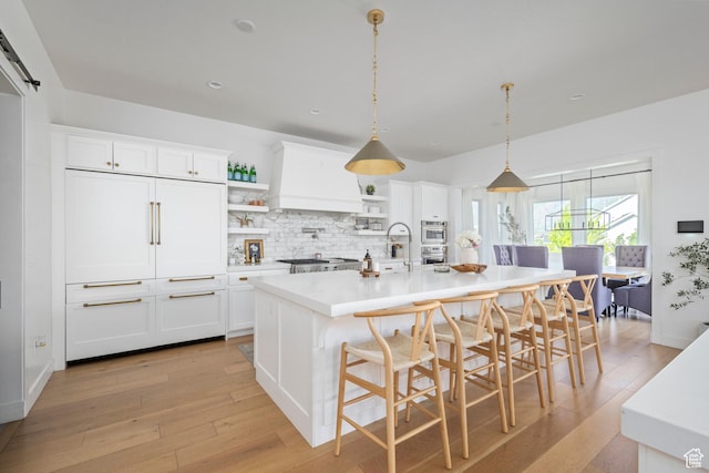 12184 N Bridgegate Way, Highland, UT 84003 - kitchen with open shelves, light wood-style flooring, light countertops, white cabinetry, and recessed lighting