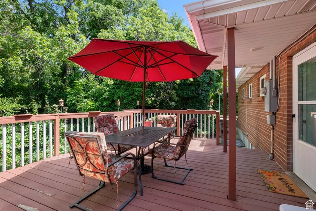 3243 S 200 W, Bountiful, UT 84010 - wooden deck with outdoor dining space and view of wooded area