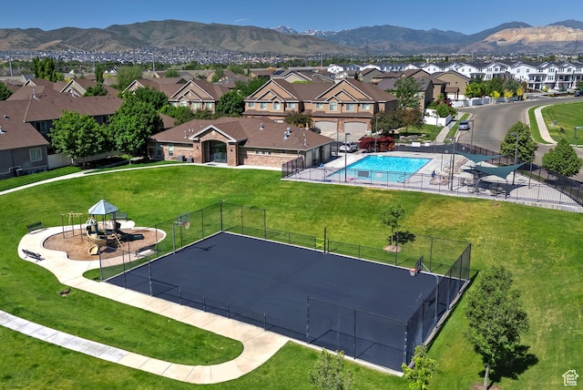 3423 W Mount Cortina Way, Riverton, UT 84065 - aerial view of residential area with a mountain backdrop and a pool area