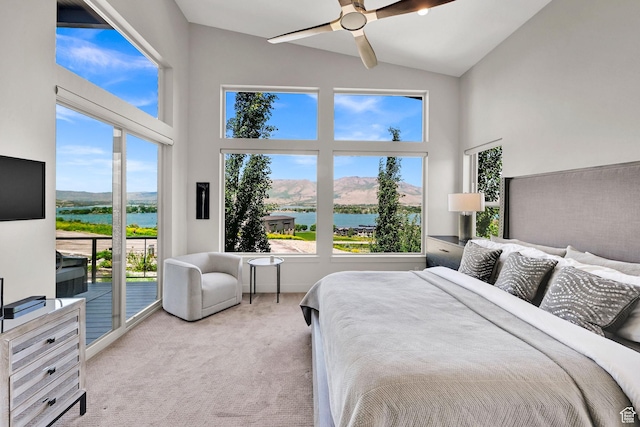 6339 E Quail Ln, Huntsville, UT 84317 - carpeted bedroom featuring access to exterior, high vaulted ceiling, a water and mountain view, and a ceiling fan