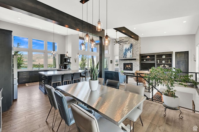 6339 E Quail Ln, Huntsville, UT 84317 - dining room featuring a high ceiling, recessed lighting, a fireplace, hardwood / wood-style flooring, and ceiling fan