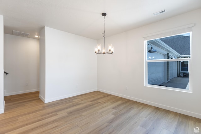 6 S 3830 W Unit 417, West Point, UT 84015 - empty room with wood finished floors, baseboards, and a chandelier