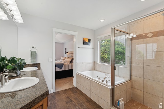 473 W 175 N, Morgan, UT 84050 - ensuite bathroom with double vanity, a shower stall, a garden tub, wood finished floors, and recessed lighting