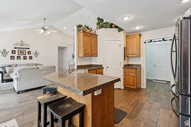 473 W 175 N, Morgan, UT 84050 - kitchen featuring freestanding refrigerator, a peninsula, a sink, vaulted ceiling, and ceiling fan