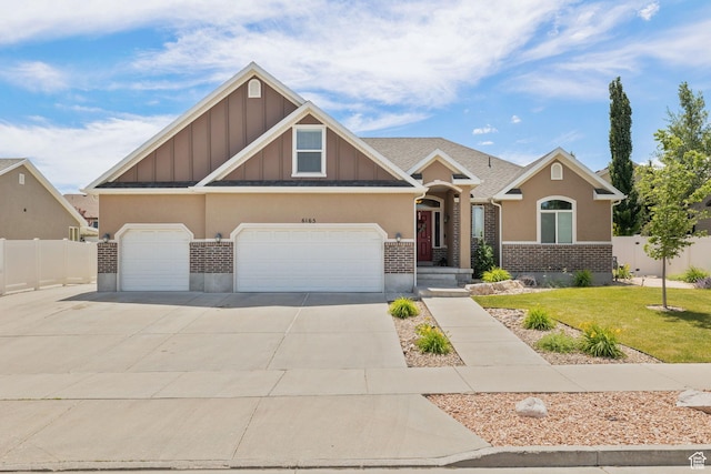 6165 W Haven Ridge Way S, West Valley City, UT 84128 - craftsman house with board and batten siding, concrete driveway, and stucco siding