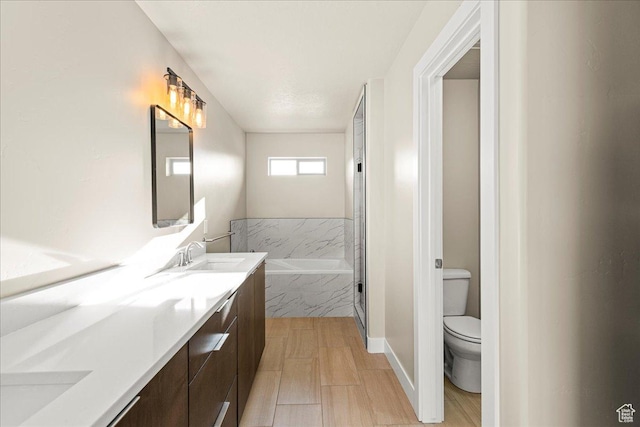 178 S Liberty St Unit 206, Grantsville, UT 84029 - full bathroom featuring toilet, double vanity, and a garden tub