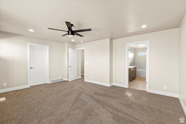 178 S Liberty St Unit 206, Grantsville, UT 84029 - unfurnished bedroom with light colored carpet, recessed lighting, baseboards, and a textured ceiling