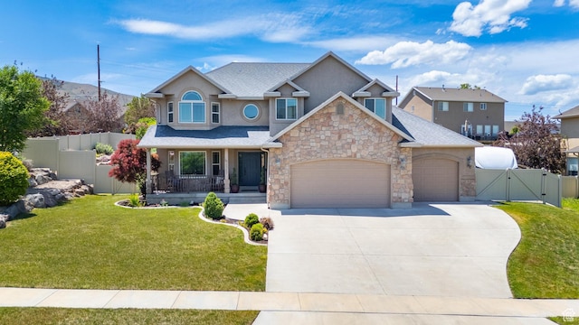 2367 S Wesson Dr, Saratoga Springs, UT 84045 - view of front facade featuring a gate, stone siding, a garage, a porch, and stucco siding