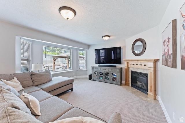2367 S Wesson Dr, Saratoga Springs, UT 84045 - living area with a textured ceiling, a tile fireplace, and baseboards