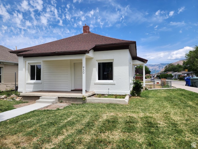 930 E 22nd St, Ogden, UT 84401 - bungalow with covered porch, a chimney, and roof with shingles