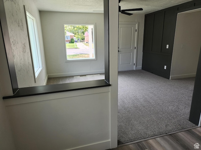 930 E 22nd St, Ogden, UT 84401 - corridor featuring a textured ceiling, baseboards, and carpet flooring