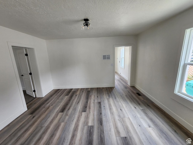 930 E 22nd St, Ogden, UT 84401 - empty room featuring wood finished floors, a textured ceiling, and baseboards