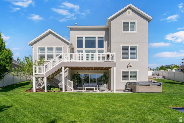 722 N Meridian Dr, Saratoga Springs, UT 84045 - rear view of house featuring a hot tub, outdoor lounge area, stucco siding, a wooden deck, and a patio