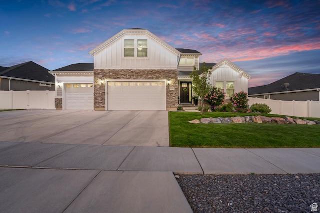 722 N Meridian Dr, Saratoga Springs, UT 84045 - view of front of home featuring stone siding, board and batten siding, concrete driveway, and a garage