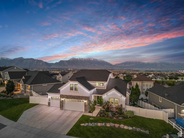 722 N Meridian Dr, Saratoga Springs, UT 84045 - view of front of house with board and batten siding, an attached garage, a mountain view, and a residential view