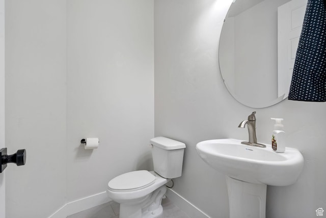 722 N Meridian Dr, Saratoga Springs, UT 84045 - half bathroom with baseboards, toilet, and tile patterned floors